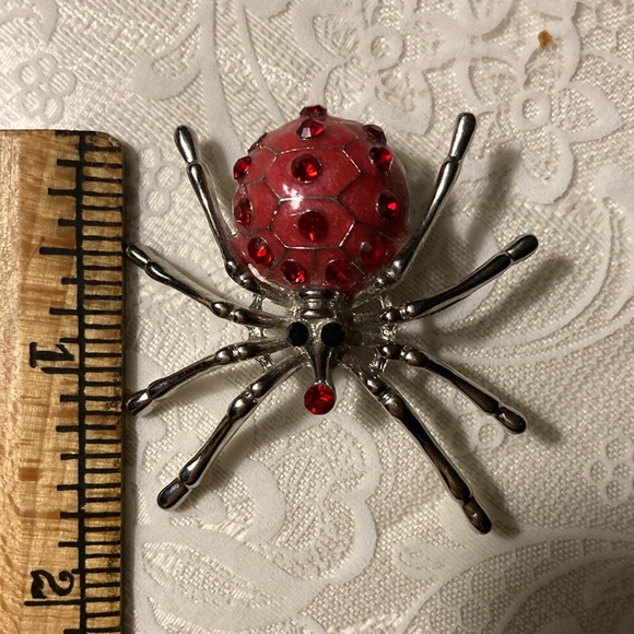 Red st spider pin, blk cord w/wooden totem $14 - Picture 3 of 4